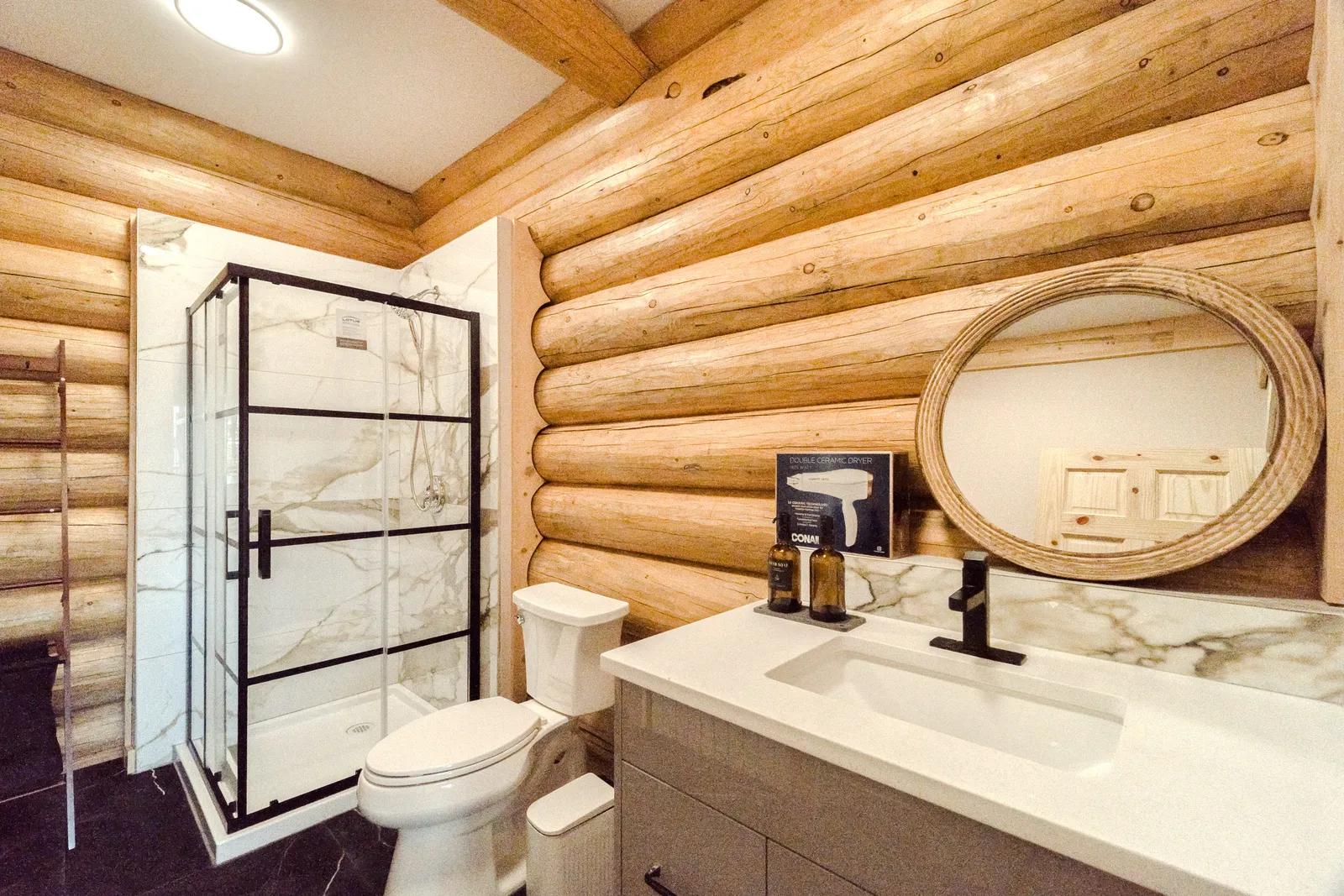 Modern bathroom inside a traditional log cabin